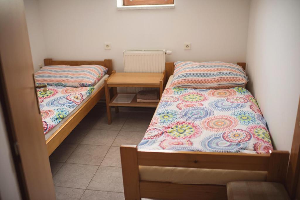 Postel nebo postele na pokoji v ubytování Penzion Nechorka