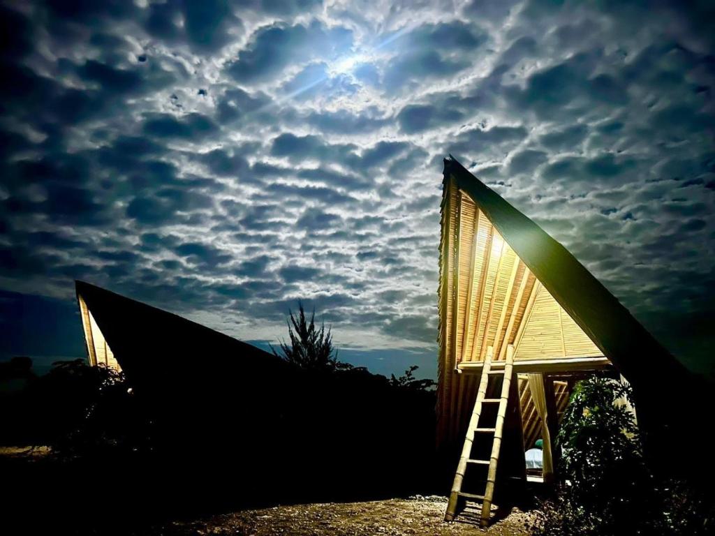 a ladder sitting in front of a building with a sky at Hars Garden Sumba in Waingapu