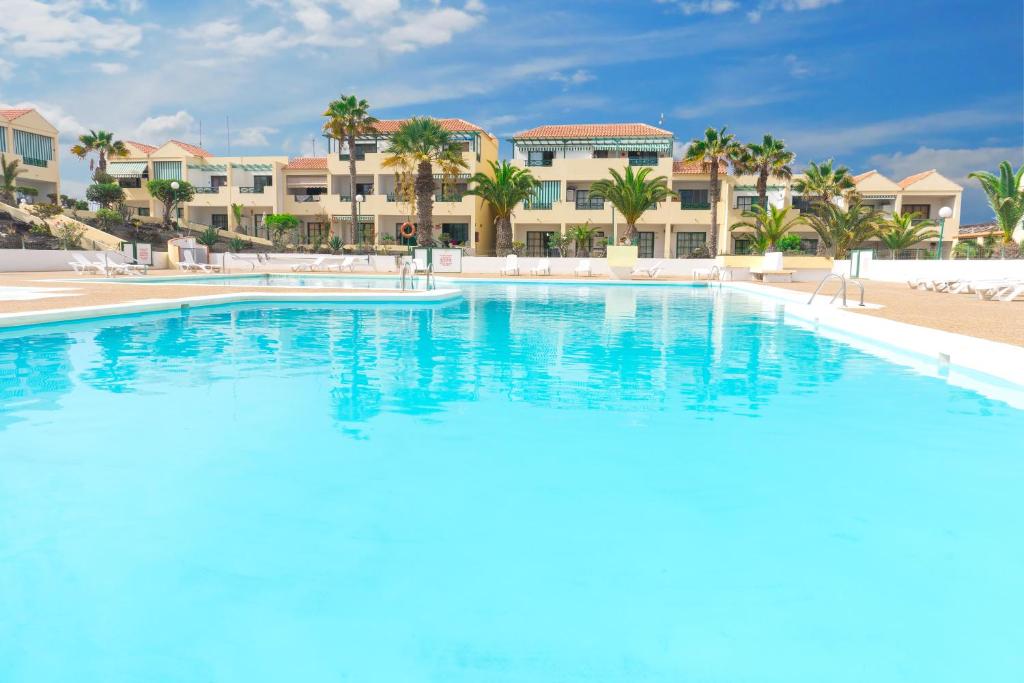 a large swimming pool in front of a resort at Casa MiraMar - Las Torres del Castillo in Costa de Antigua