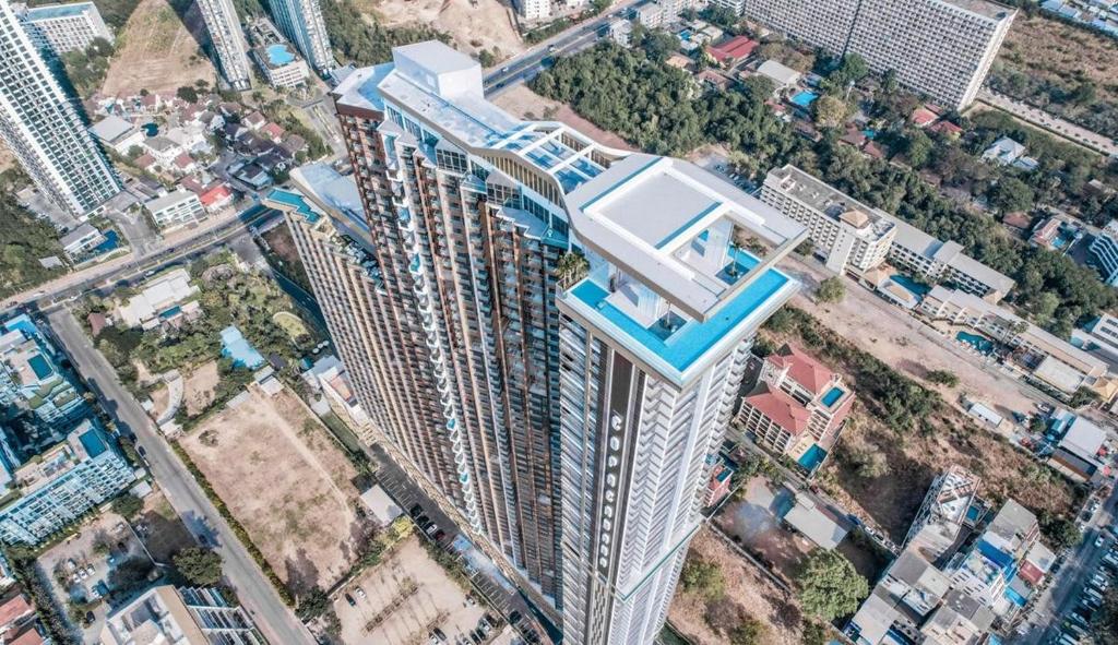 an overhead view of a tall building with a house on top at Copacabana Beach Jomtien in Jomtien Beach