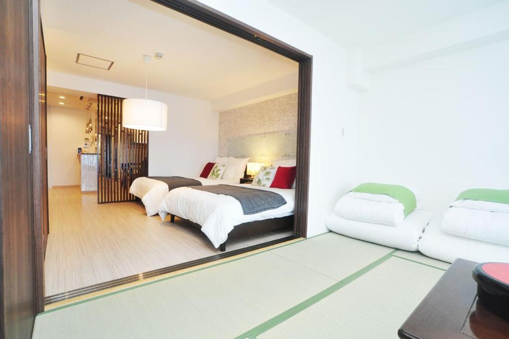 Voodi või voodid majutusasutuse guest house Sakura toas