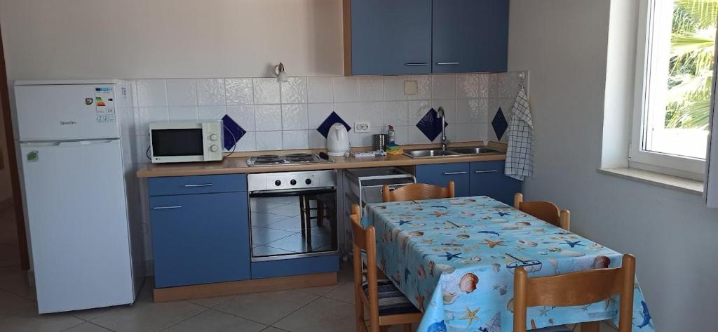 Kuchyňa alebo kuchynka v ubytovaní Apartmani Zulin