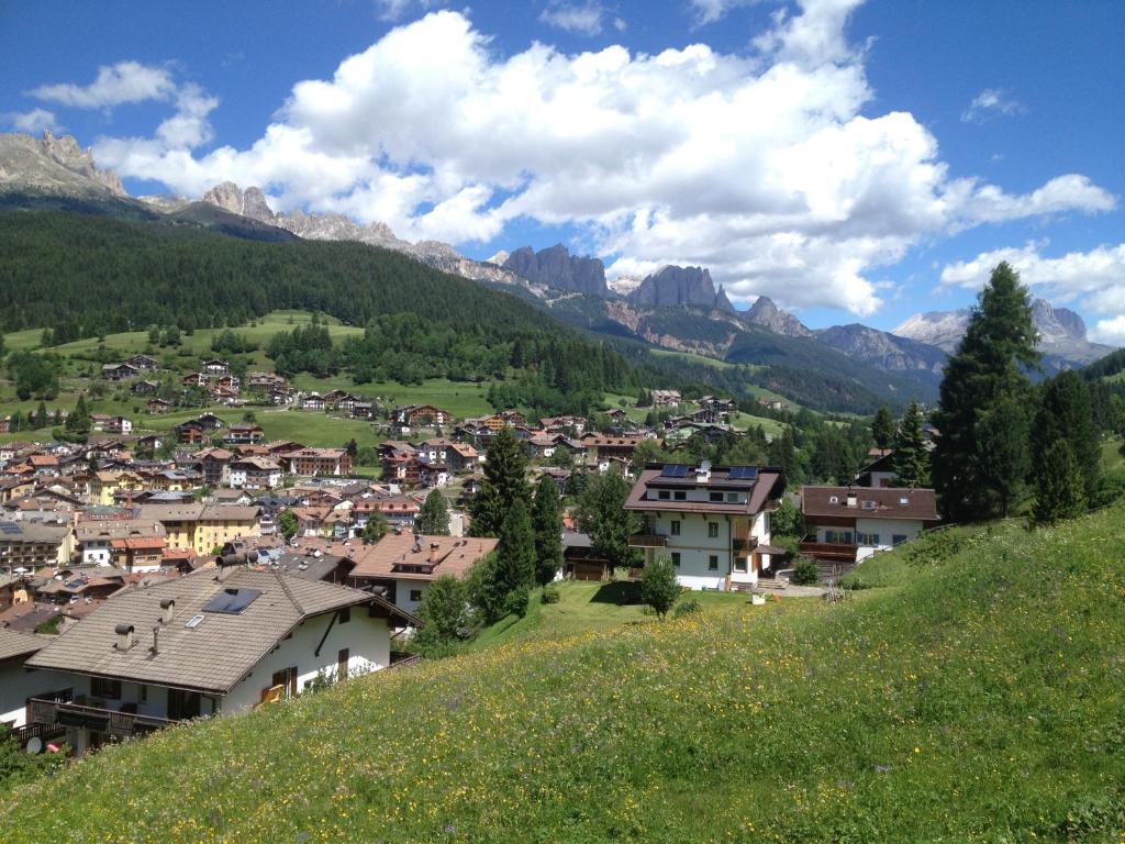 a small town in a valley with mountains at Villa Montana in Moena