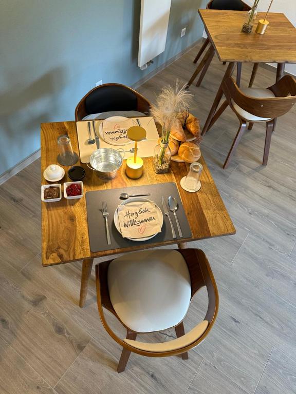 a wooden table with food on top of it at B&B Alferweiher in Echternach