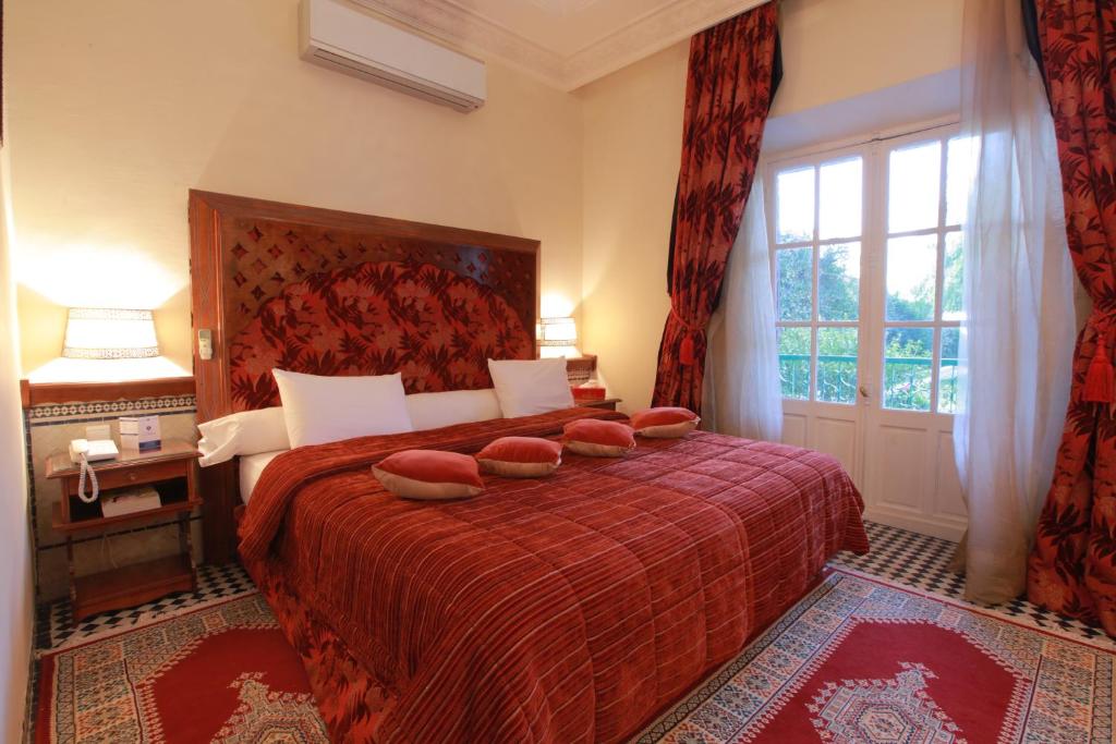 Postel nebo postele na pokoji v ubytování Hotel Transatlantique
