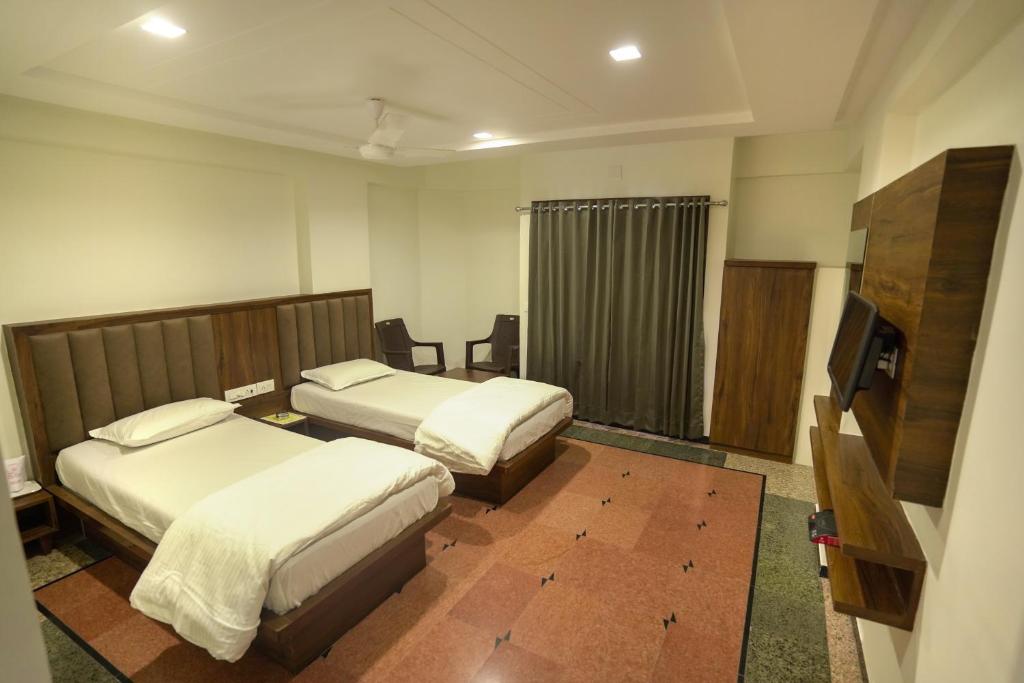 Postel nebo postele na pokoji v ubytování Hotel Shertown