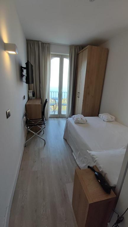 Łóżko lub łóżka w pokoju w obiekcie Splendid Hotel Taormina