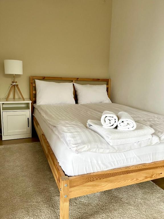 Posteľ alebo postele v izbe v ubytovaní Apartamenty Lobeliowy Port