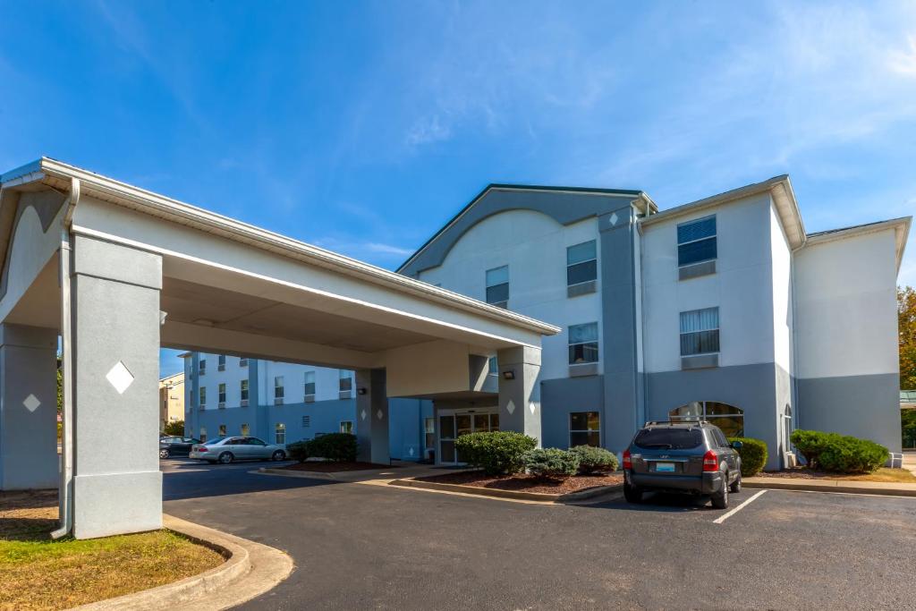 a parking lot in front of a building at Super 8 by Wyndham La Grange KY in La Grange