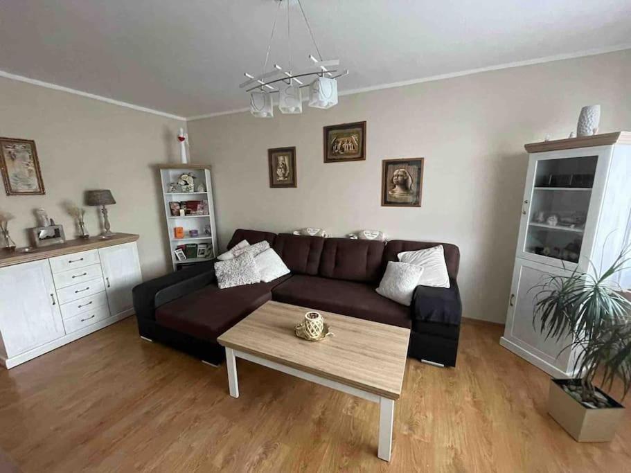 a living room with a couch and a coffee table at 3 izbový byt in Liptovský Mikuláš