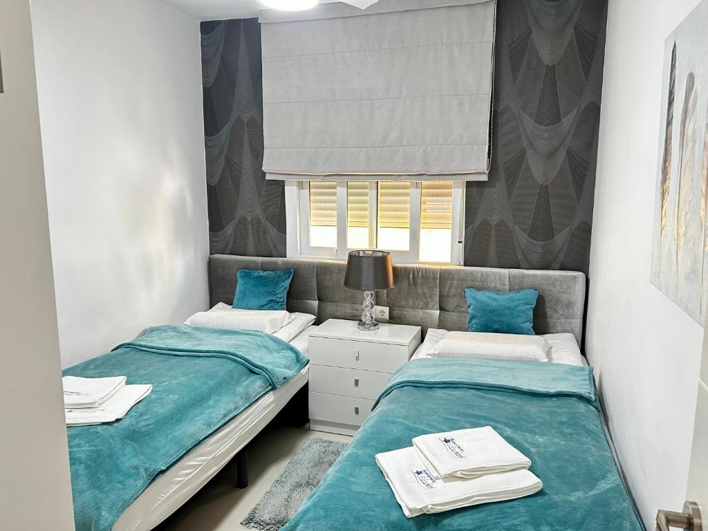 Posteľ alebo postele v izbe v ubytovaní Apartamento Elizabeth