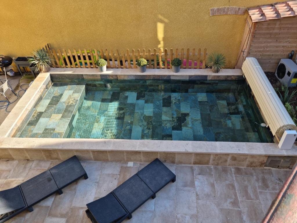 Πισίνα στο ή κοντά στο Maison bourgeoise avec piscine privée