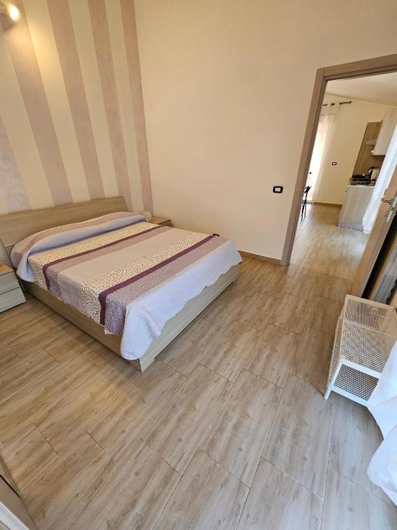 Łóżko lub łóżka w pokoju w obiekcie Villa Center appartamenti nel verde in città