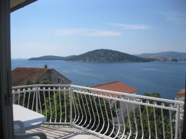 a balcony with a view of a large body of water at Villa Curkovic in Ražanj