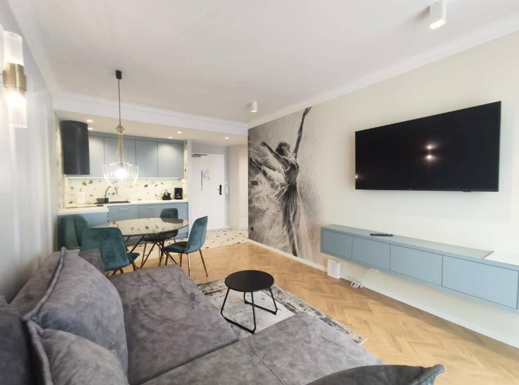 Televízia a/alebo spoločenská miestnosť v ubytovaní Apartament Westin House 312