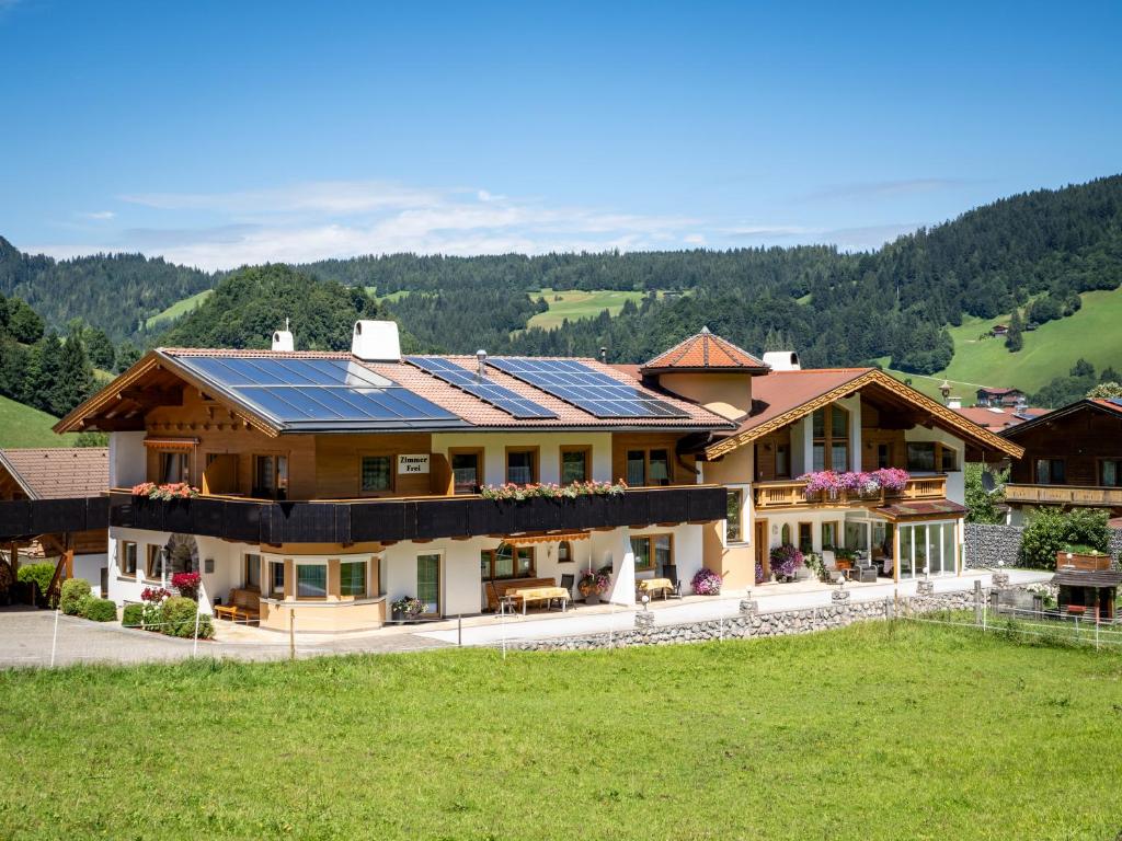 a house with solar panels on the roof at Haus Daniela in Wildschönau