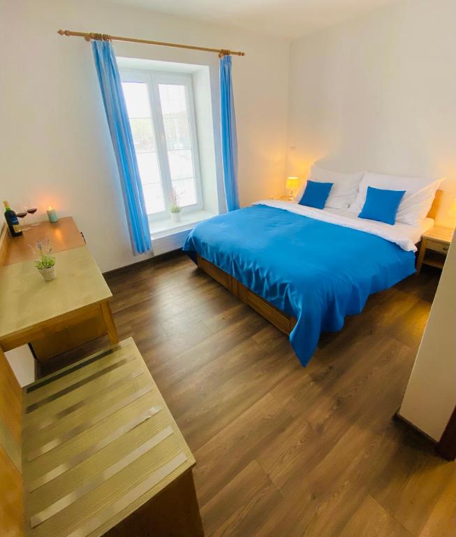 Postel nebo postele na pokoji v ubytování Resort Rybníček