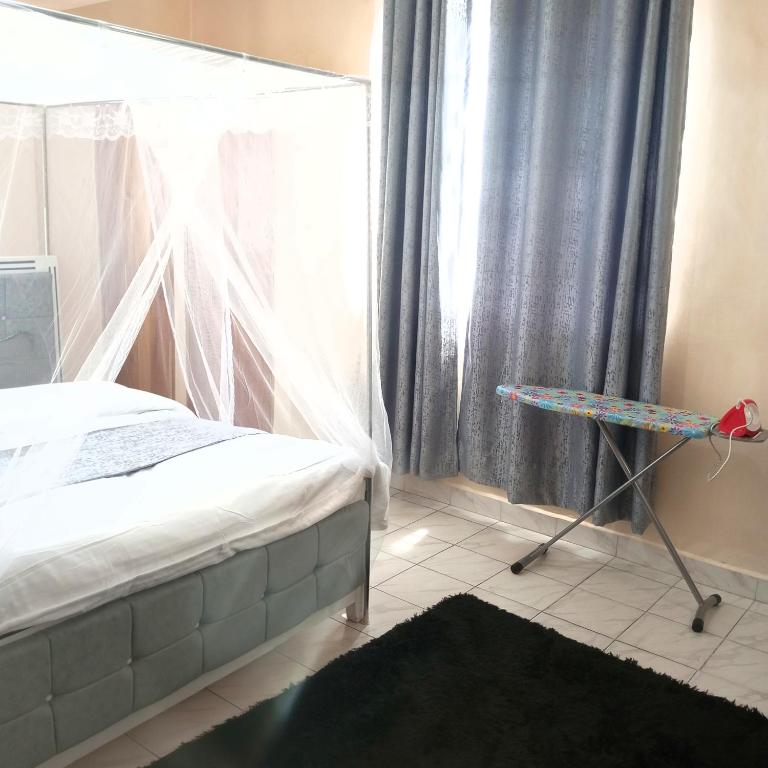 Postel nebo postele na pokoji v ubytování Milly's homes