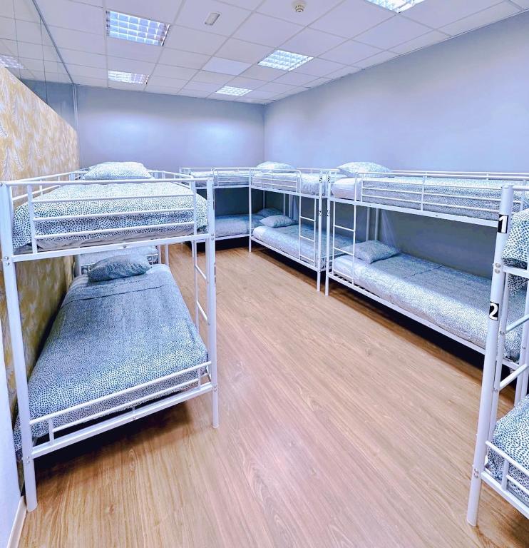 Postel nebo postele na pokoji v ubytování Hostel Acacias