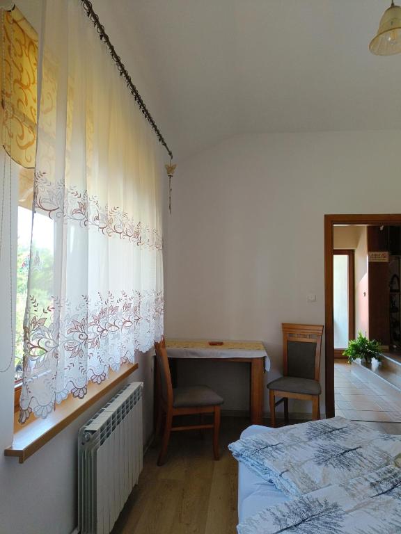 Postel nebo postele na pokoji v ubytování Pod Modrzewiami
