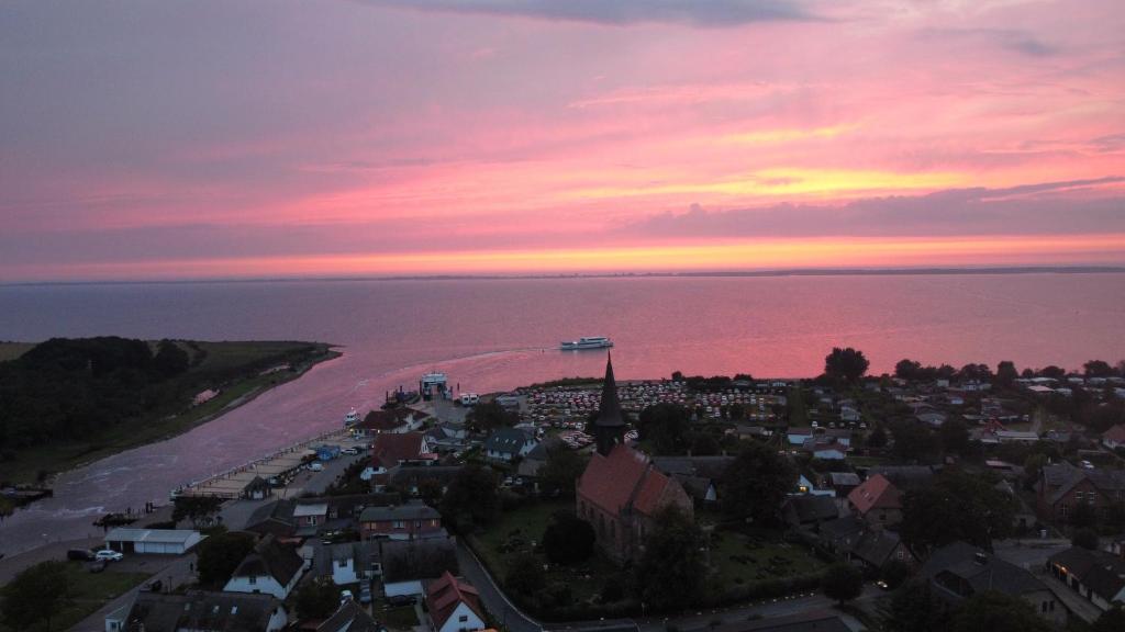 an aerial view of a city with a sunset at Wohlfuehl-Orte24 am Hafen in Schaprode, Rügen in Schaprode