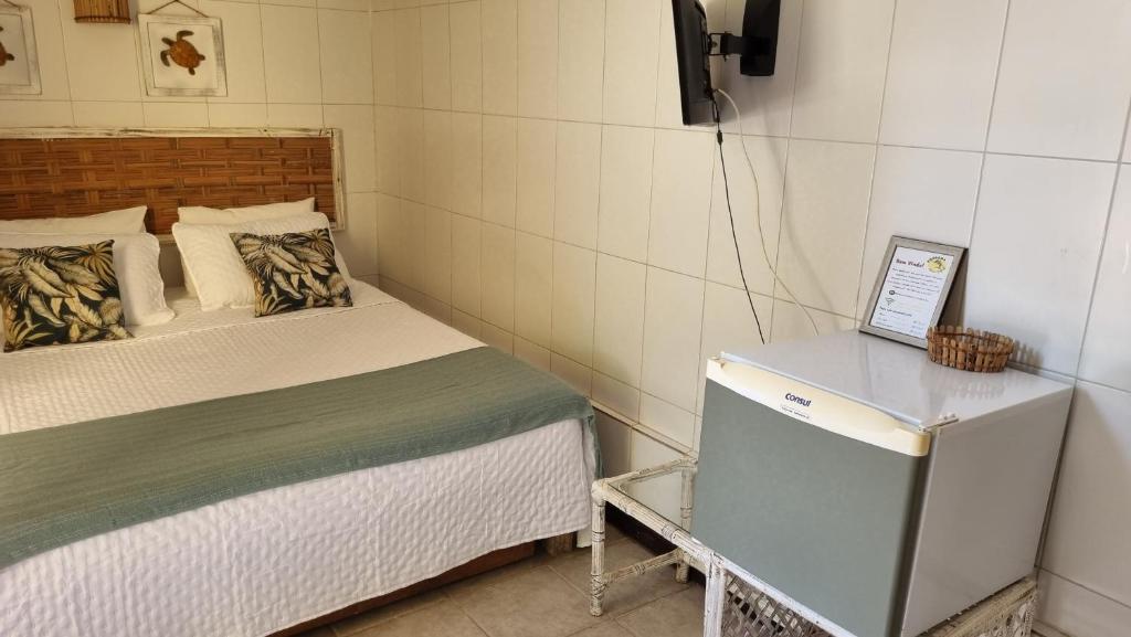 Postel nebo postele na pokoji v ubytování Pousada Peixe Espada