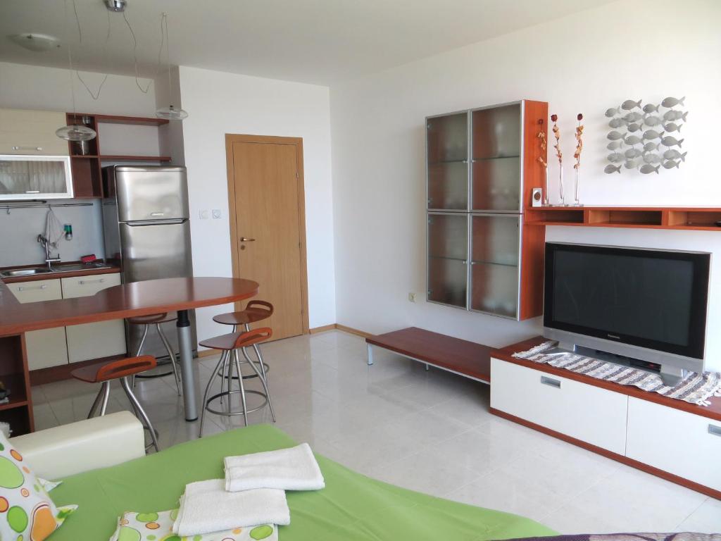 A kitchen or kitchenette at Holiday Apartment in Riviera Complex