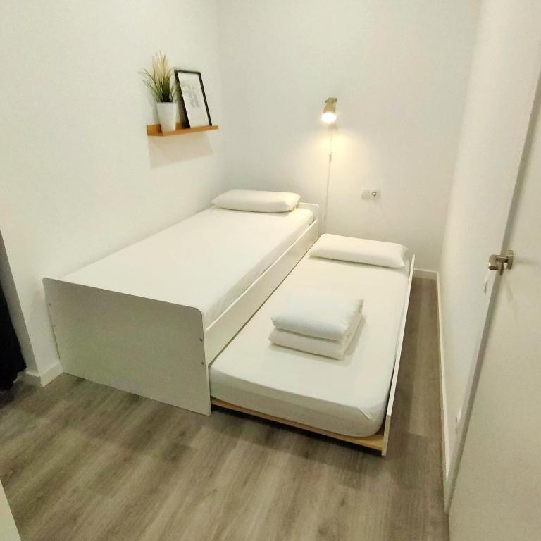 Postel nebo postele na pokoji v ubytování Mediterranean Barcelona Apartments