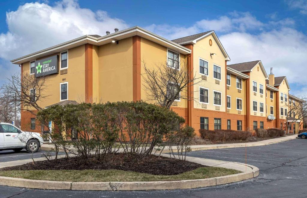 a building on a street with a tree in front of it at Extended Stay America Suites - Philadelphia - Horsham - Welsh Rd in Horsham