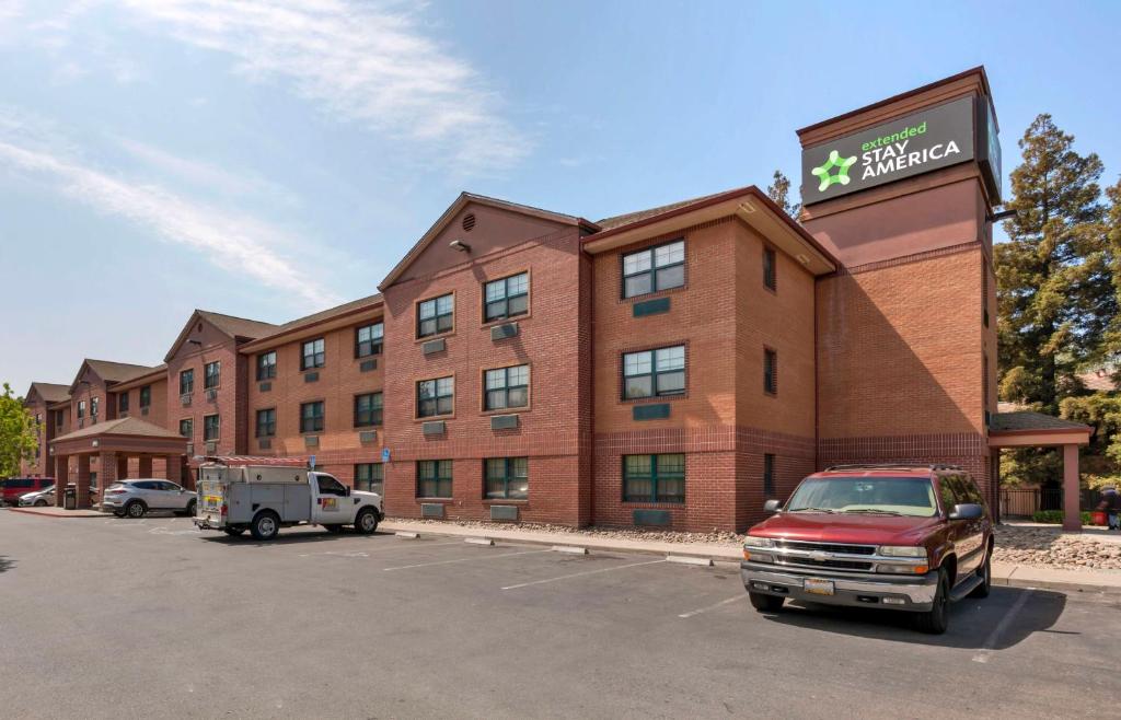 a hotel with a truck parked in a parking lot at Extended Stay America Suites - Stockton - March Lane in Stockton