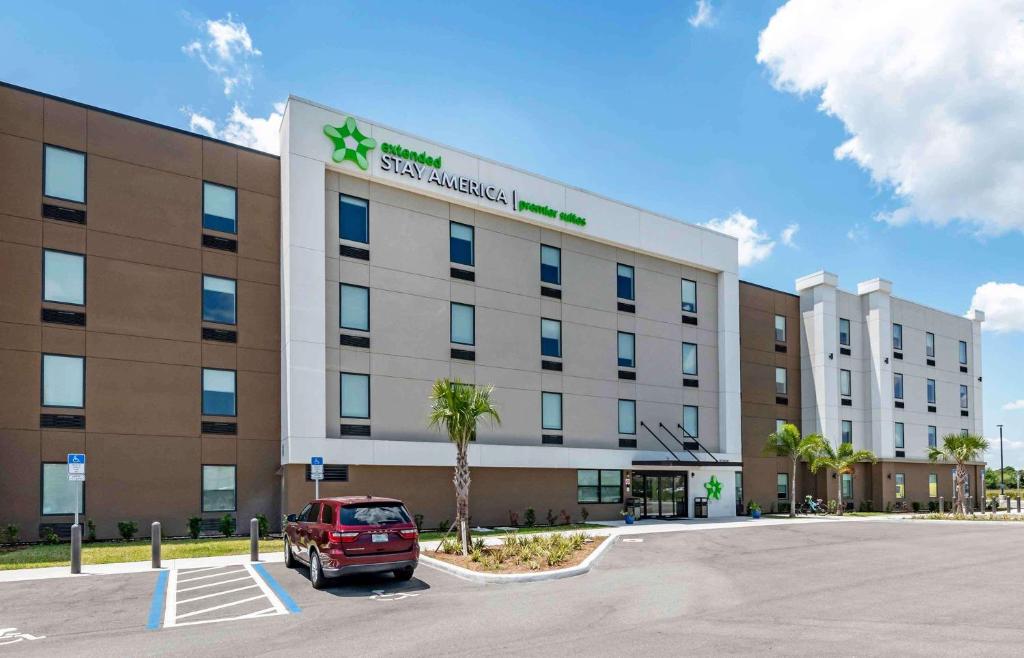 a car parked in a parking lot in front of a hotel at Extended Stay America Premier Suites - Melbourne - I-95 in West Melbourne