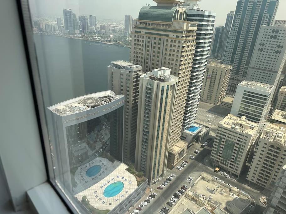 an aerial view of a city from a skyscraper at شقة البحيره in Sharjah