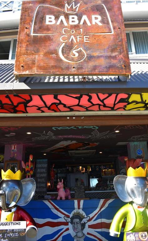 a bar sign on the front of a restaurant at Hotel Beaurivage in Noumea