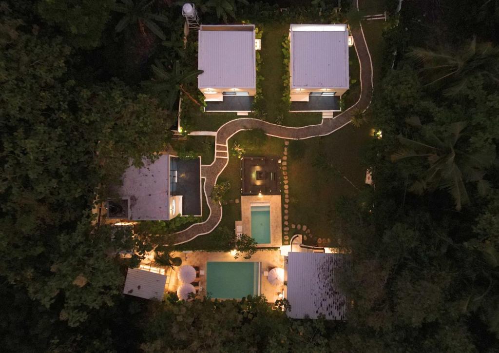 an aerial view of a house at night with lights at The Volter Yogyakarta in Ngingas