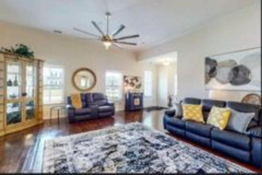 a living room with a couch and a rug at The Lucky Charm in Savannah