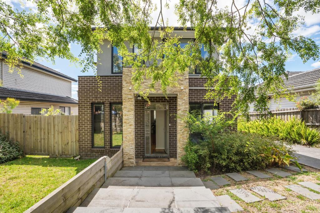 a brick house with a tree in front of it at New Comfort house near Box Hill in Nunawading