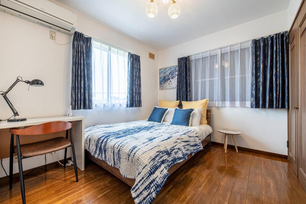 Postel nebo postele na pokoji v ubytování Nine Villa Kujukuri