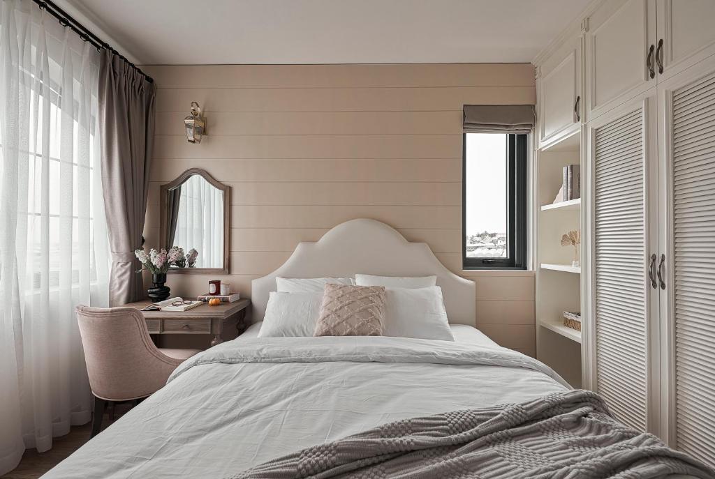 Postel nebo postele na pokoji v ubytování Davilla Đà Lạt Villa Collection