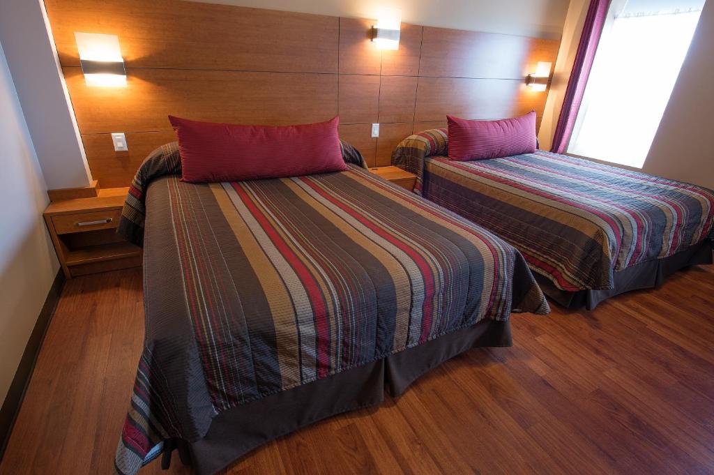 Postel nebo postele na pokoji v ubytování Hotel du Fjord