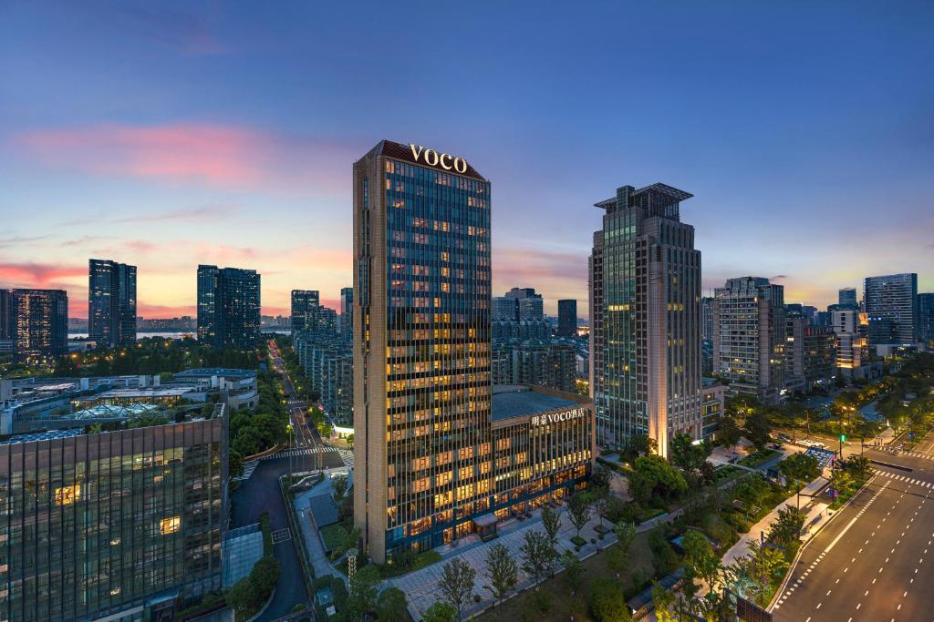 an aerial view of a tall building in a city at voco - Hangzhou Binjiang Minghao, an IHG Hotel in Hangzhou