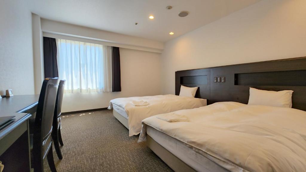 Letto o letti in una camera di Platon Hotel Yokkaichi