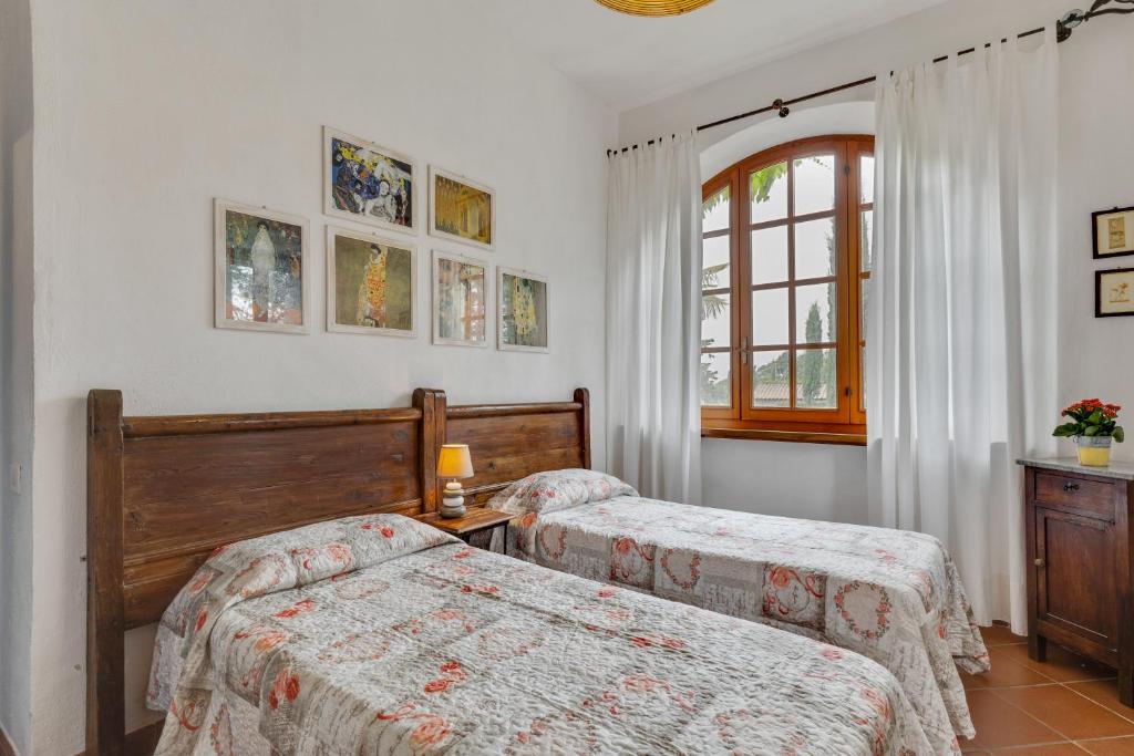 Postel nebo postele na pokoji v ubytování Agriturismo San Tommaso