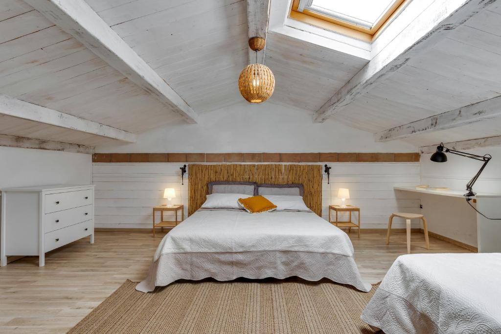 Postel nebo postele na pokoji v ubytování Agriturismo San Tommaso