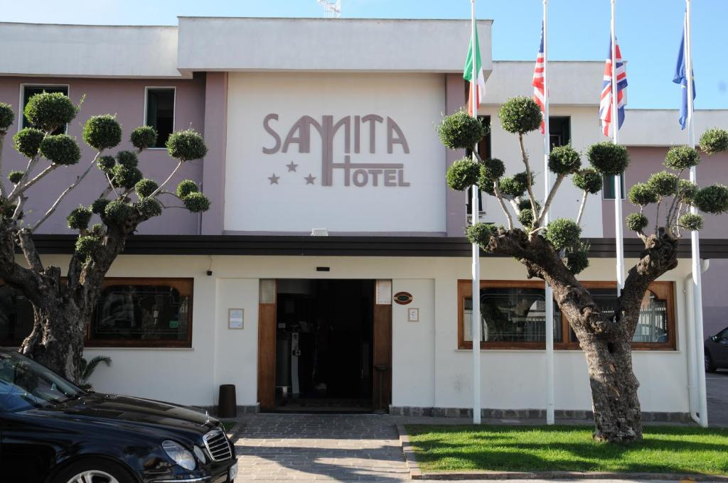 a car parked in front of a hotel at Hotel Sannita in Casoria