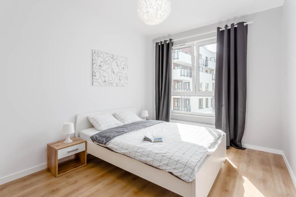 Postel nebo postele na pokoji v ubytování Chill Apartments Ursus