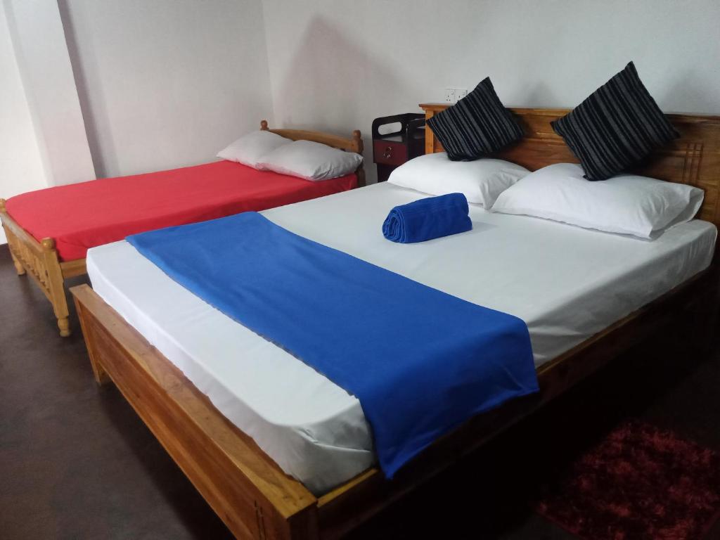 Postel nebo postele na pokoji v ubytování Himansa Homestay