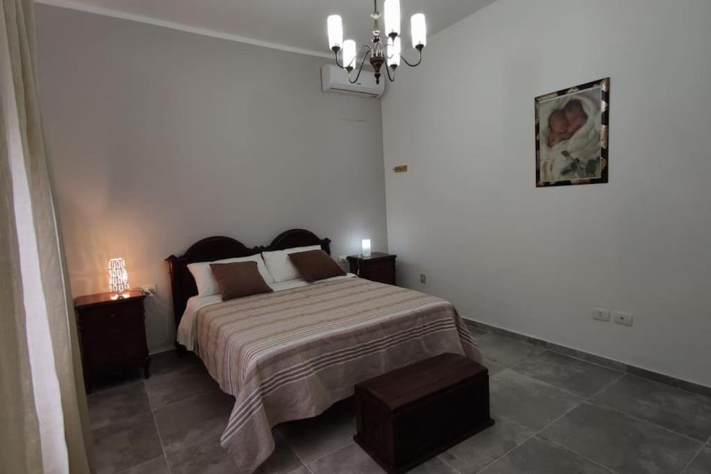 Postel nebo postele na pokoji v ubytování Villa in campagna vicina al mare Bonerelax