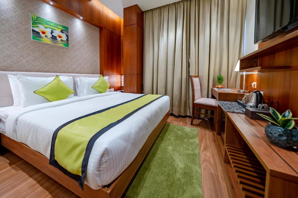Postel nebo postele na pokoji v ubytování Payel Inn