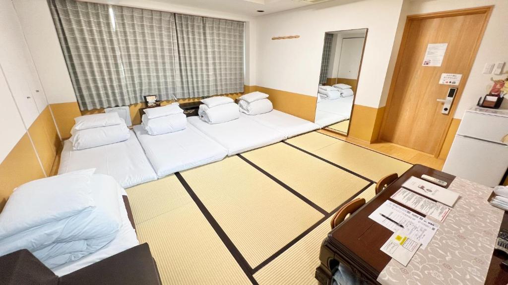 a hospital room with several beds and a window at Reina Building 4F / Vacation STAY 40669 in Tokushima