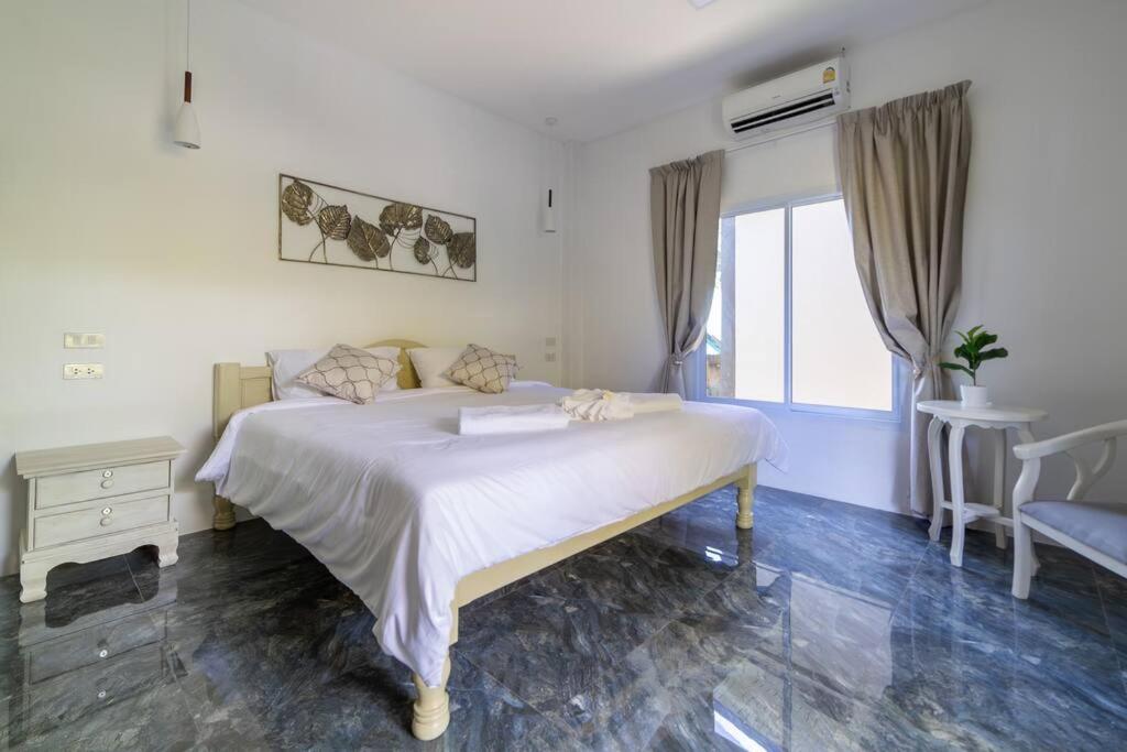 Postel nebo postele na pokoji v ubytování Apple Villas
